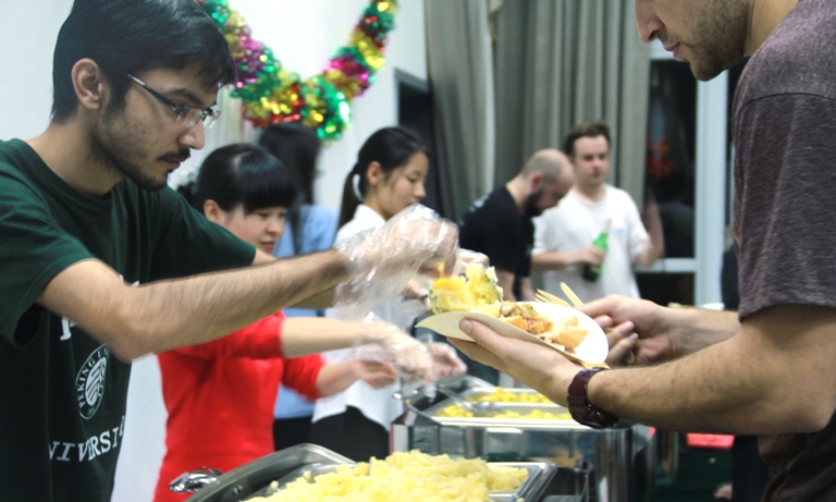 2nd year PHBS student Sunny Mewati helps serve guests