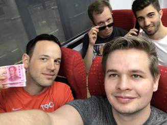 "Shenzhen Rangers" (Maximilian, Jan, Martin, and Andreas) riding Line 11's business class